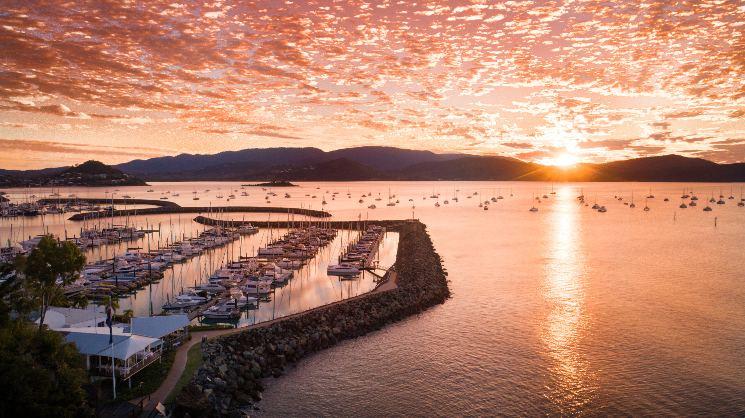 drone view of sunset over the marina